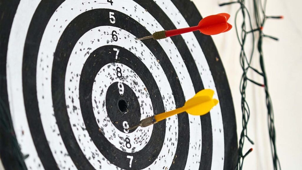 Dartboard showing darts near the bullseye. Identify the goals and targets for your business so you can measure your online success.