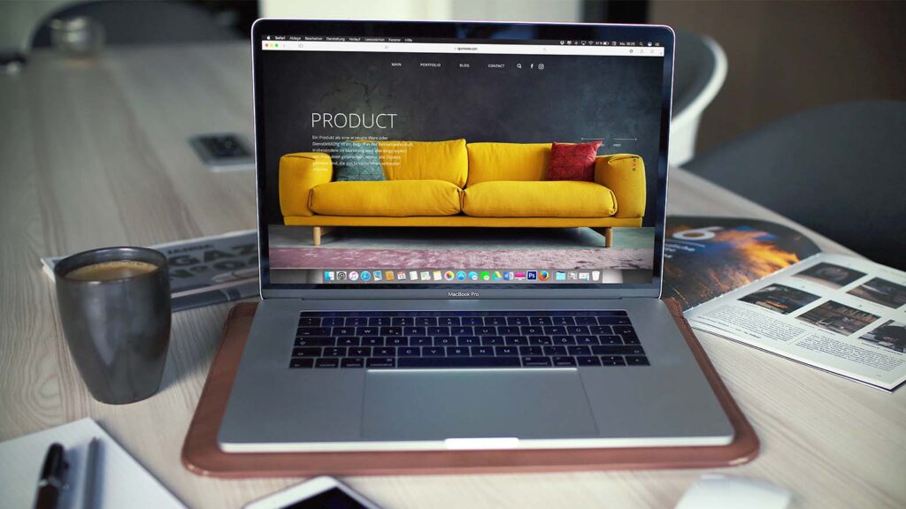 Photo of a product page in an online shop -- a laptop shows a yellow couch with the headline "Product"