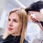 hair salon client receiving a blowout - marketing your salon business depends on choosing the right keywords for your services