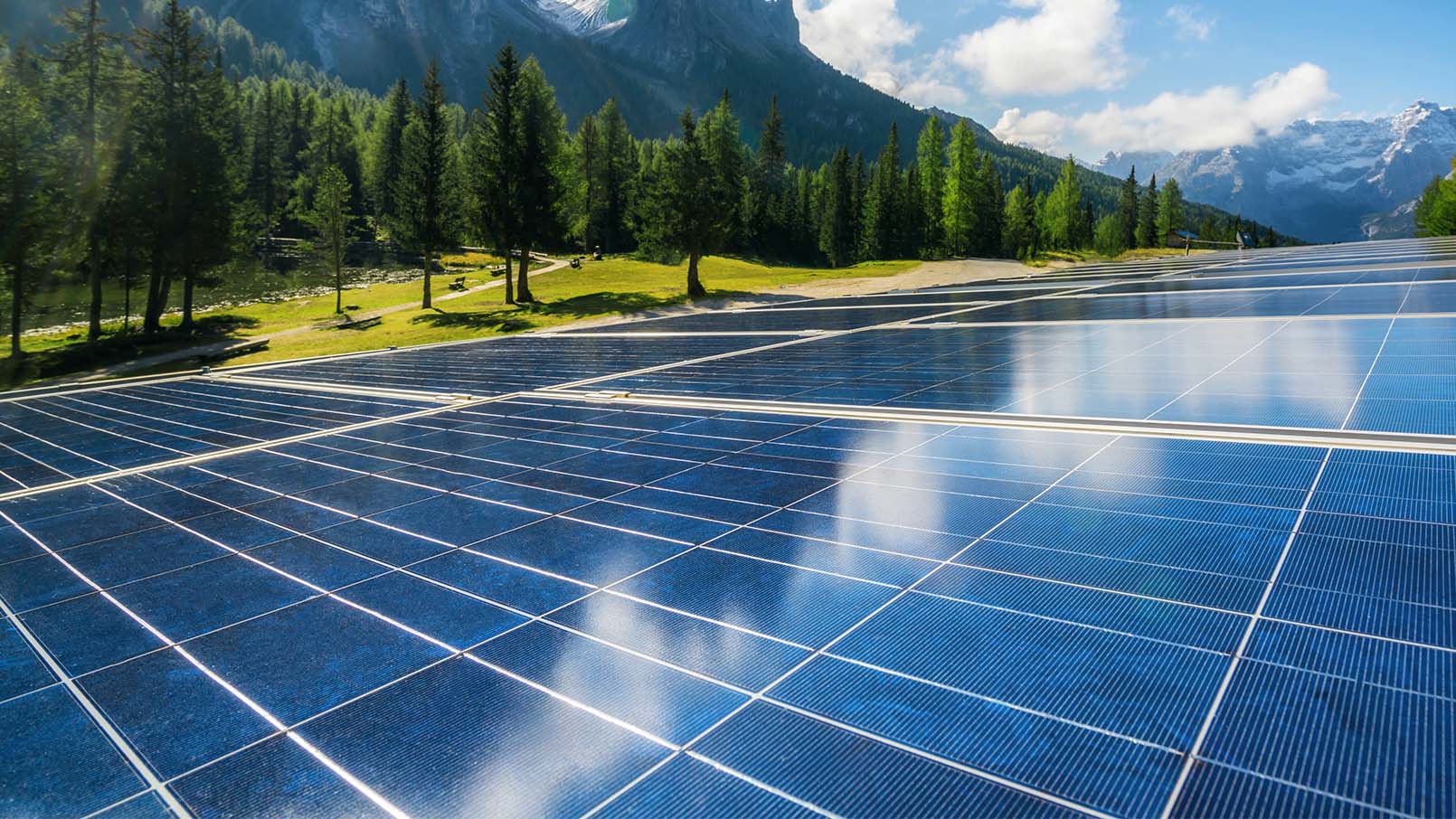 solar panels in a picturesque scene with mountains in the background